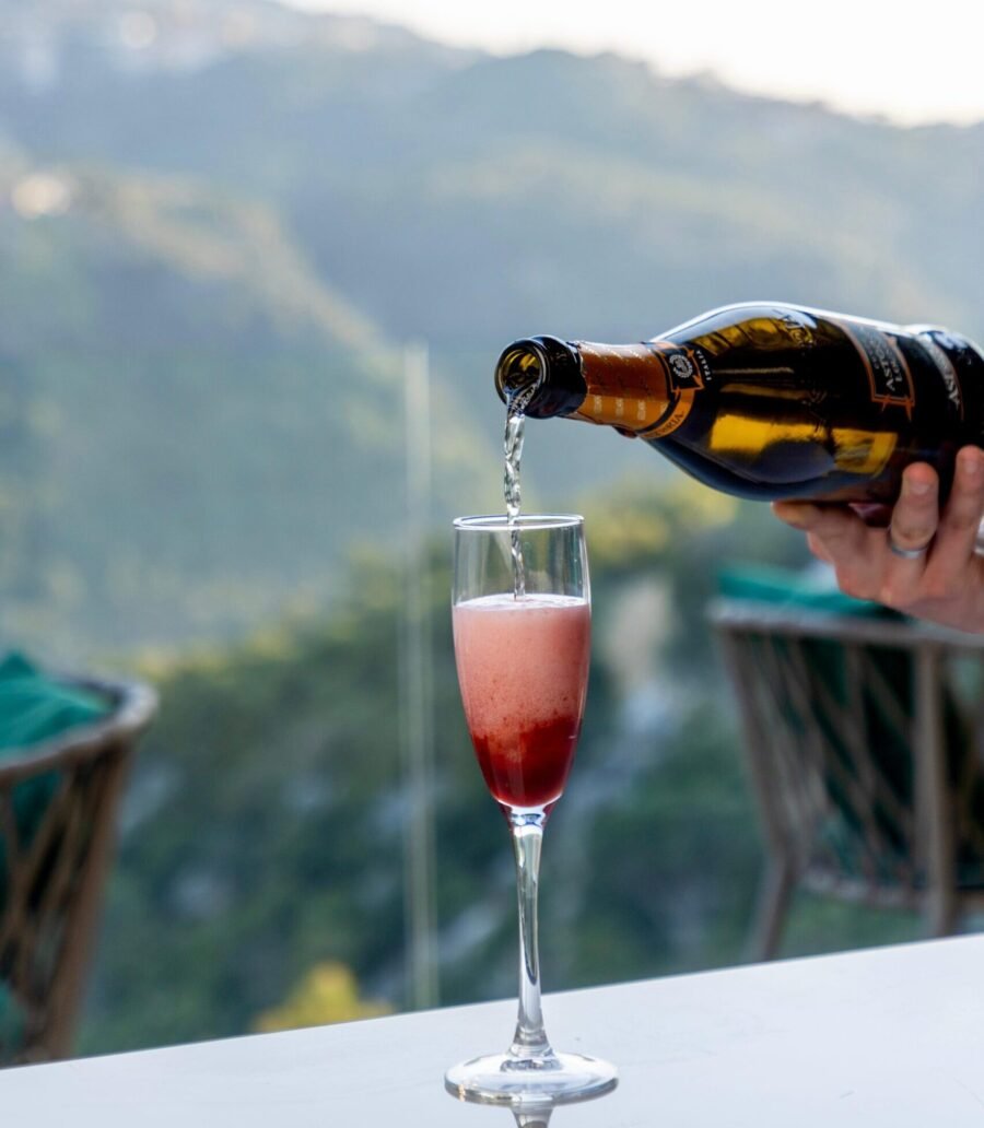 Scappa resort drink menu, prosecco glass with mountain view