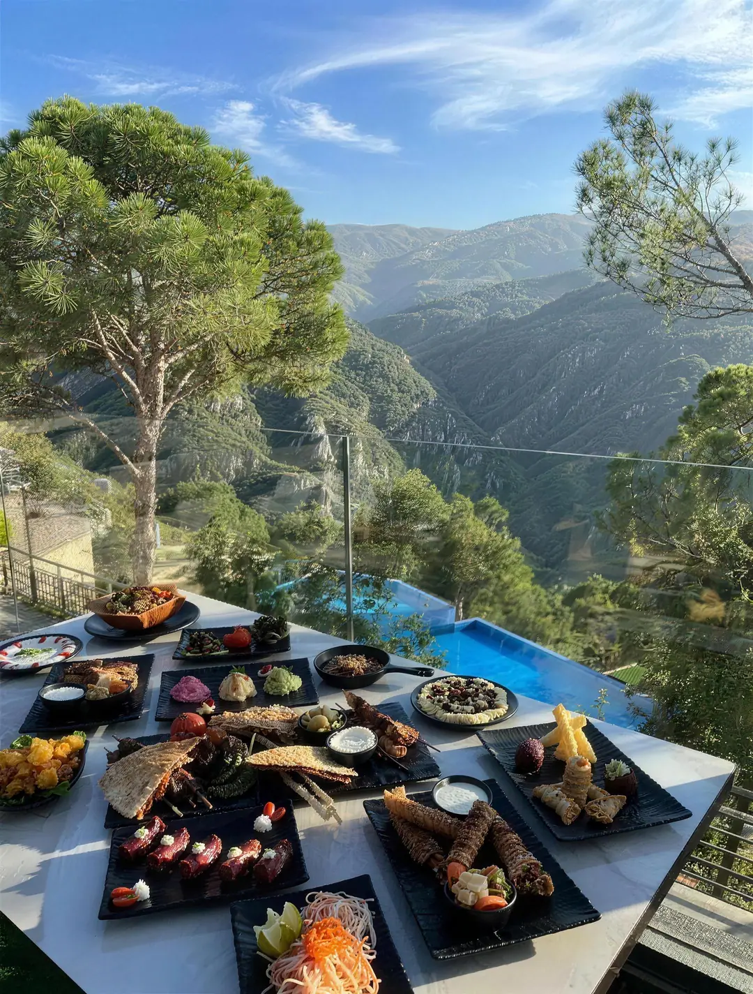 Lebanese mezze on a Scappa restaurant table beside the infinity pool