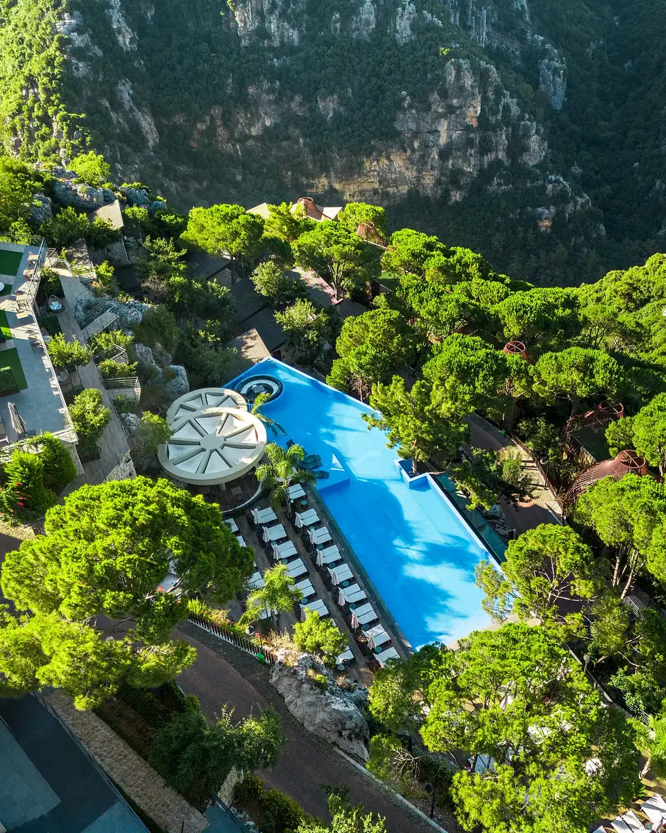 Aerial view of the Scappa infinity pool and round lounge above the Ajaltoun valley