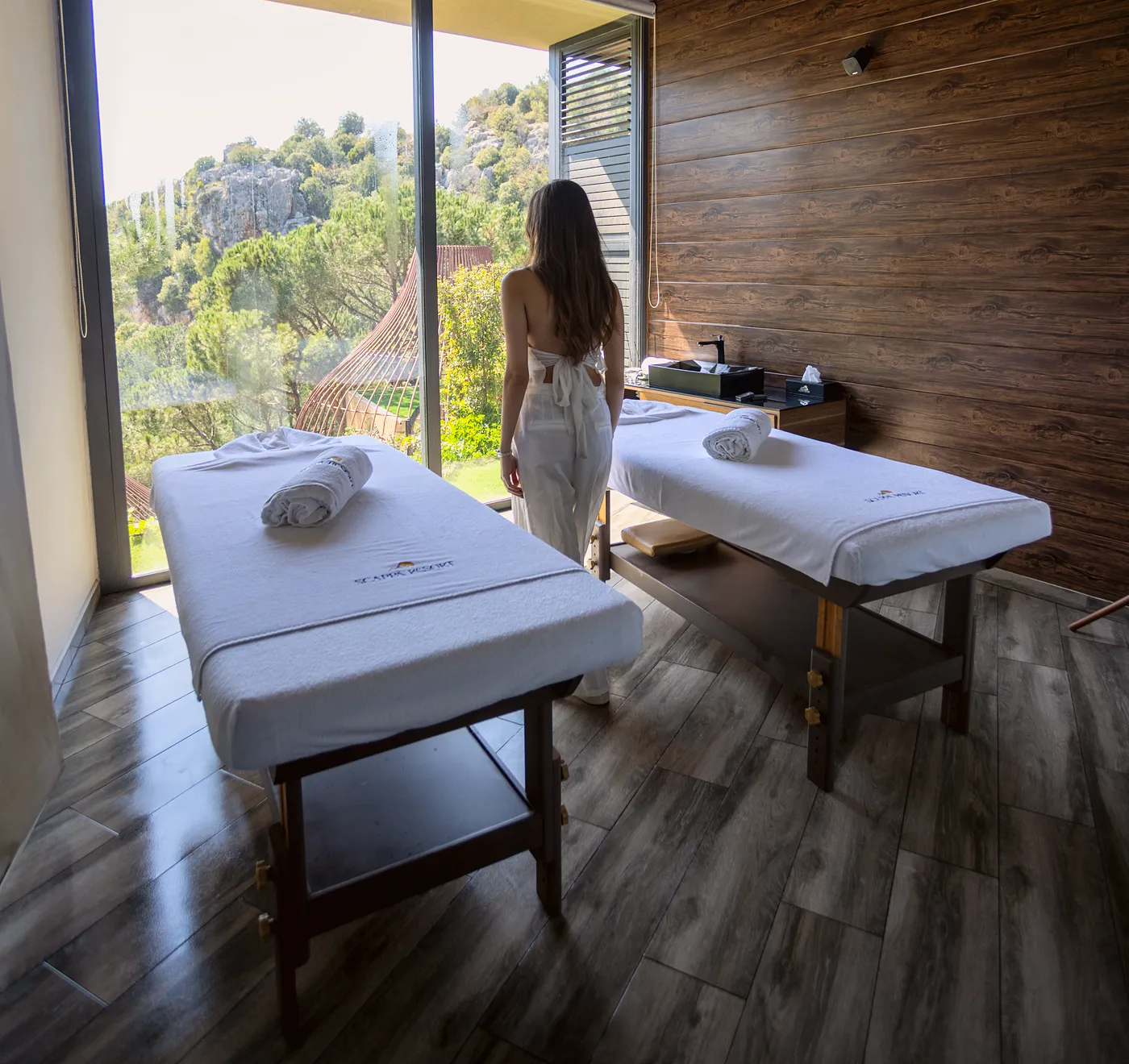Scappa spa treatment room with two massage beds and the garden view